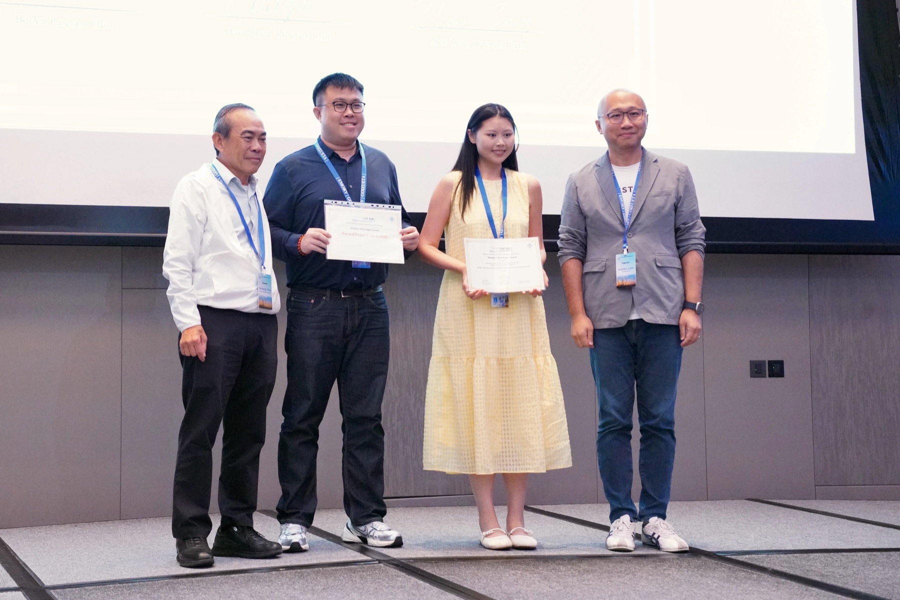 Shuangyan Deng receiving the ICAIF 2025 Best Paper Award certificate on stage